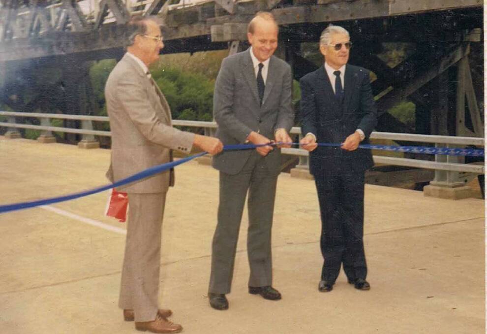 Bridge opening: Eden-Monaro MP Jim Snow, cuts the ribbon with Bega Valley Shire president, Bruce Hetherington (left) and DMR engineer Bob Harris.
