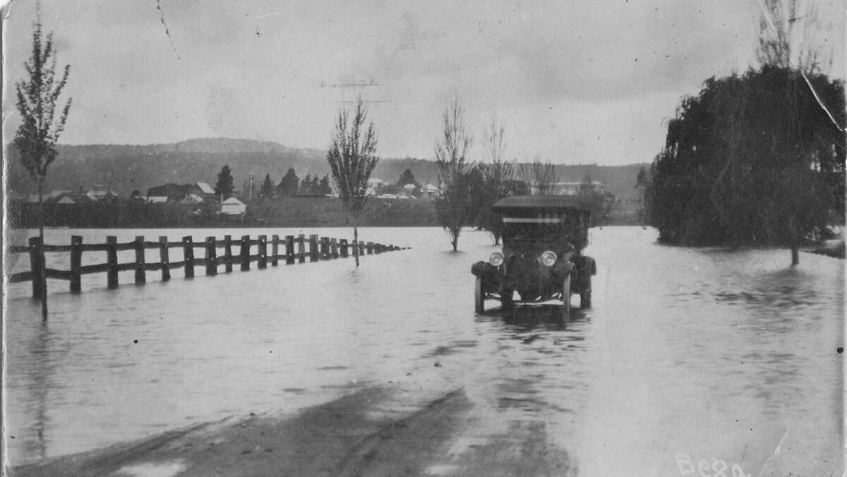 Water hazards: A vehicle tries to negotiate a flooded road during one of the many floods that hit the Bega district early last century.