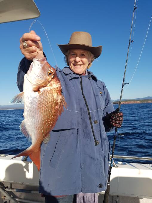 Fish dinner: Linda Miller shows her lovely snapper taken off Long Point while fishing from local charter boat Rathlin II. Beautiful pan-sized fish of 1-2kg are biting along our local reefs.