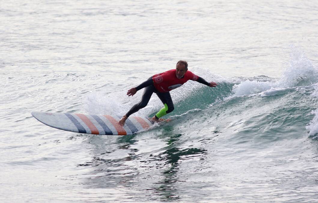 RIDE TO GLORY: Warilla surfer John Skinner excelled to win the over-50 men's title at the NSW Longboard Titles on Bellambi Beach on June 24-26. Picture: Ethan Smith/Surfing NSW