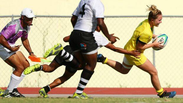 Lilly-Rose Bennett of Australia scores a try during the match between Fiji and Australia in the Girls Rugby Sevens. Photo: Scott Barbour