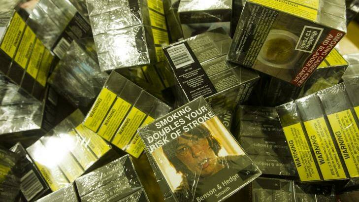 A pile of cigarette packets with plain packaging. Photo: Nic Walker