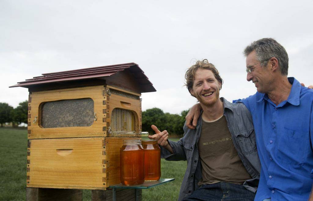 Toast of the internet: Father and son Stuart and Cedar Anderson with their invention, the 'flow hive'.