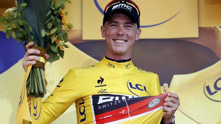 Aussie Rohan Dennis proudly wears the race leader's yellow jersey on the podium after winning the first stage of the Tour de France.  Photo: ERIC GAILLARD