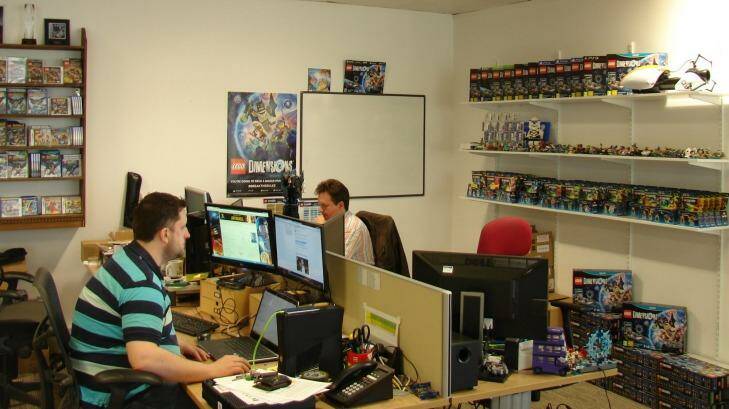 TT Games employees hard at work, surrounded by products from Lego Dimensions, TT's toys-to-life game.