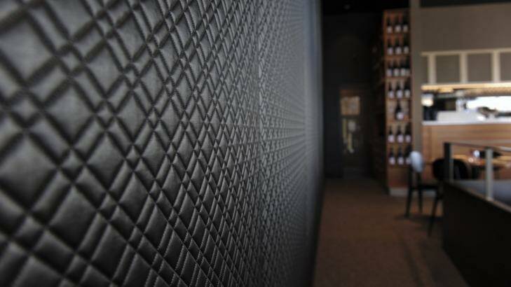 The black quilted feature wall highlights the contemporary feel at Aubergine.  Photo: Graham Tidy