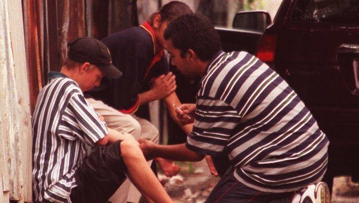Heroin users on the footpath in Redfern in 1999. Photo: Julian Andrews