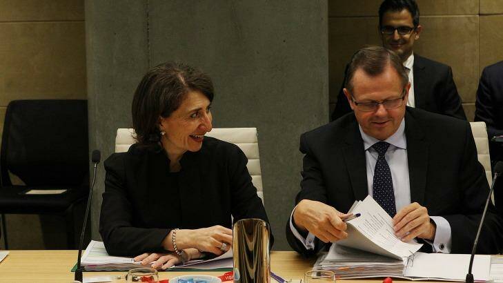 NSW Treasurer Gladys Berejiklian next to Rob Whitfield, Secretary of NSW Treasury. Photo: Peter Braig