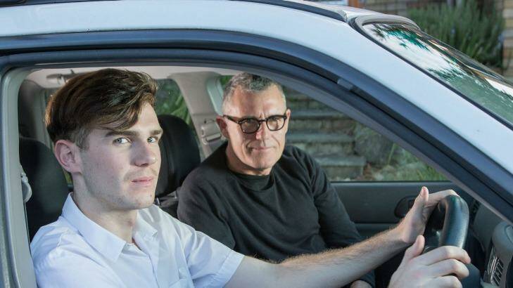 P-plate driver Reilly King, 17, with his father Adrian, says his mother has been talking to him about driving safely for "at least five years". Photo: Cole Bennetts