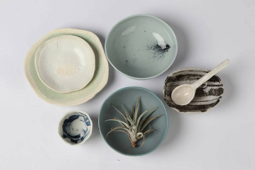 Bit on the side: Side plates to steal centre stage. From left, entree plate with green glaze, $40, mhceramics.net; "sel" (salt) dish, $25, mhceramics.net; marbled pinch pot, $26, millydent.com; blue and green bowls by Naomi Taplin, $45, small-spaces.com.au; and bowl and spoon by Keiko Matsui, $65, small-spaces.com.au. Photo: Ben Rushton