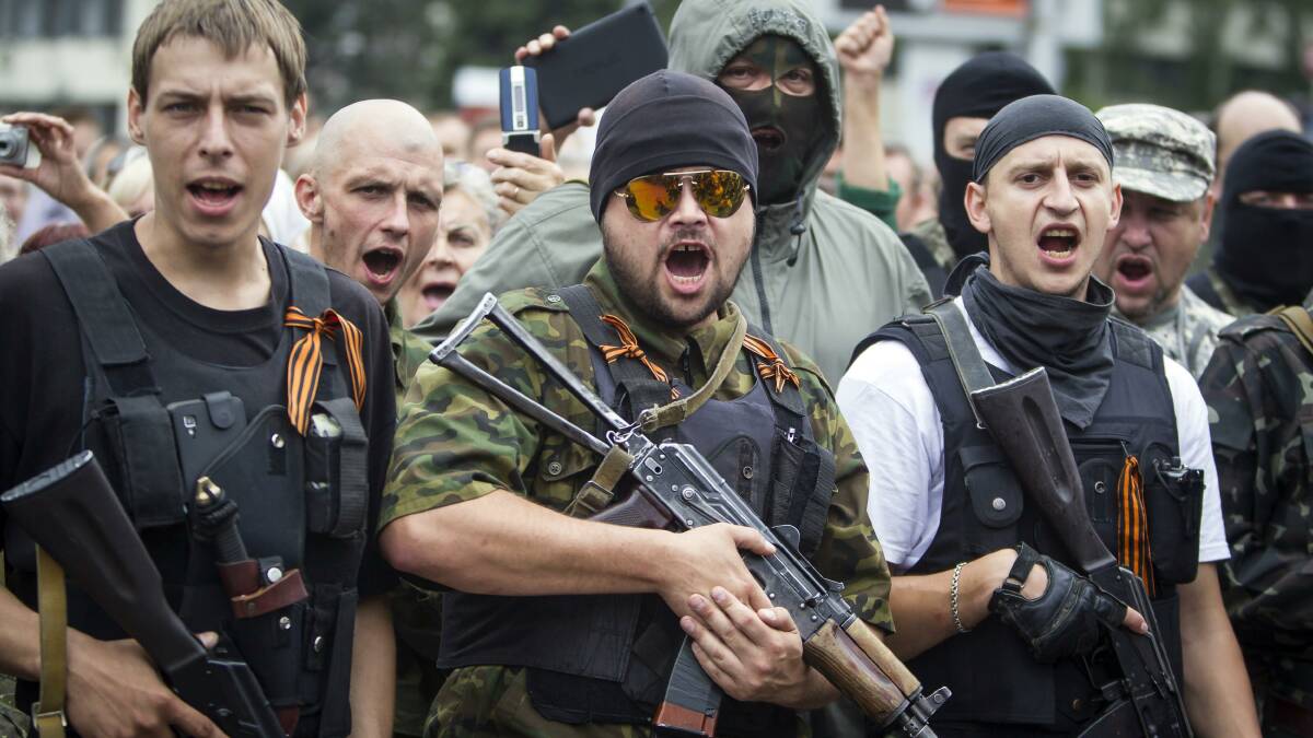 Armed pro-Russian separatists of the self-proclaimed Donetsk People's Republic pledge an oath during ceremony in the city of Donetsk, June 21, 2014. Picture: Reuters.