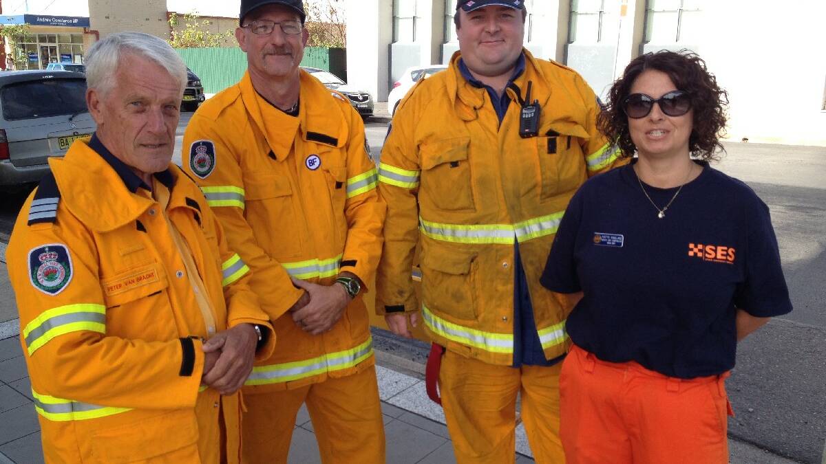 Rural Fire Service volunteers (from left) Peter Van Bracht, Baden Edwards and Cameron Bell with Yvette Ringland from the Bega Valley SES 