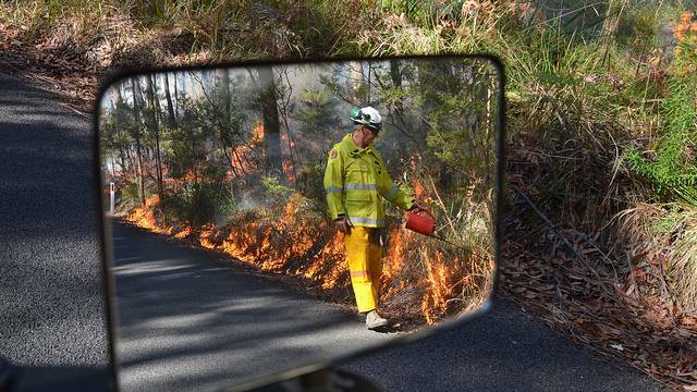 NPWS officer Roger Dunn NPWS reducing the risk of wildfire through hazard reduction burning in the Ulladulla area. Photo: Mike Jarman