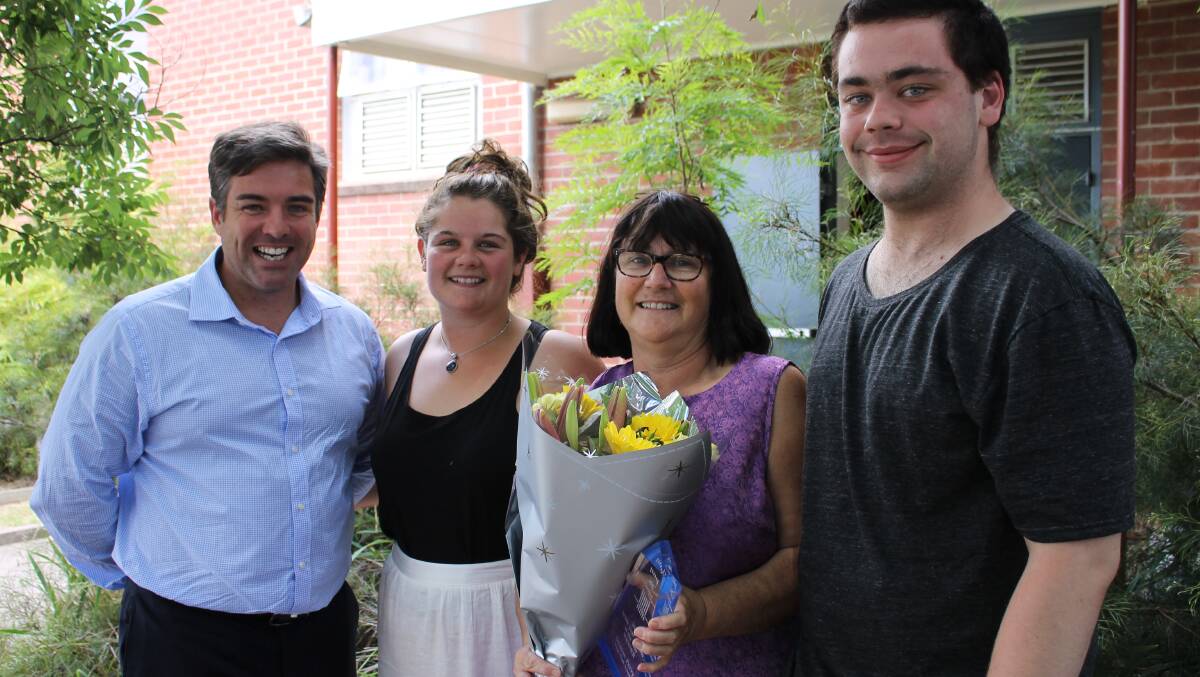 Bega High’s Denise Perry (second from right) receives her Student Engagement 2014 NSW Year Adviser of the Year award from the organisation's founder, Tim Heinecke (left), accompanied by two of her Year 12 students Emily Pearce and Tas Fitzer. 