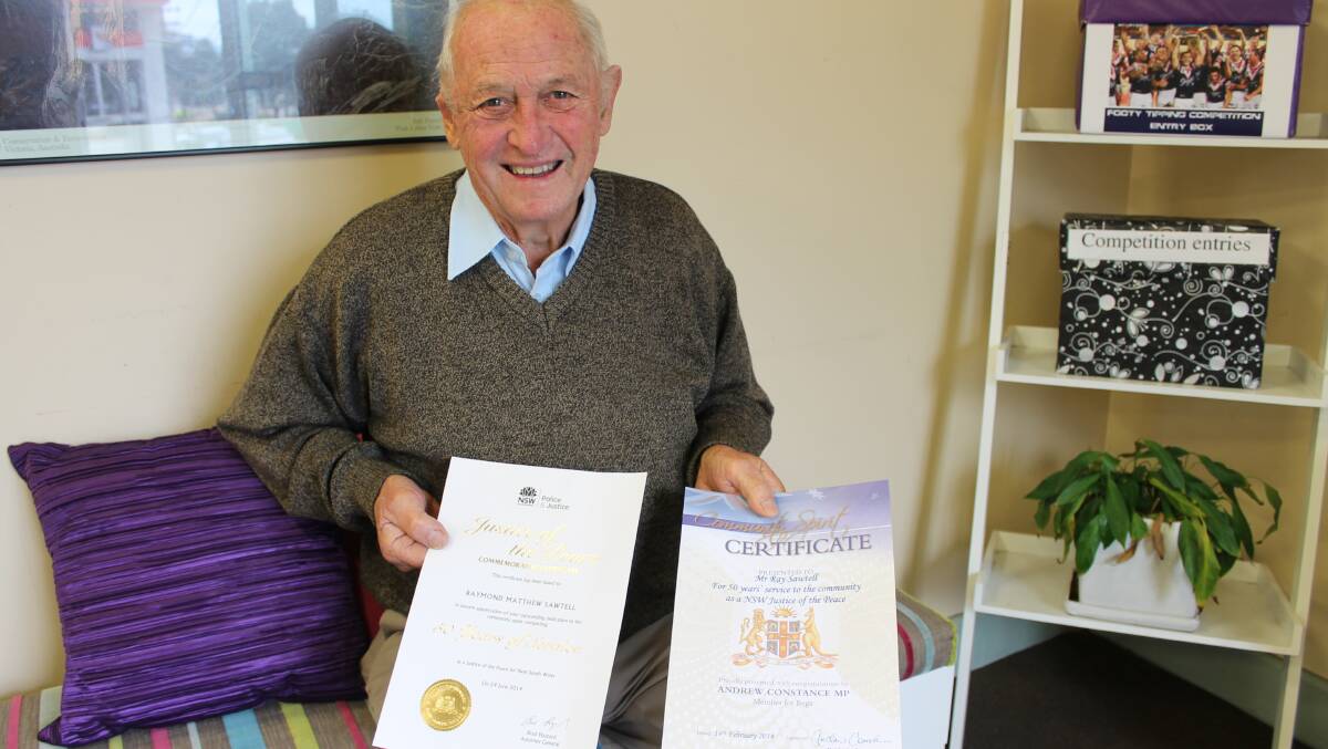 Ray Sawtell of Cobargo shows off his certificates recognising 50 years of service to the community as a Justice of the Peace.
