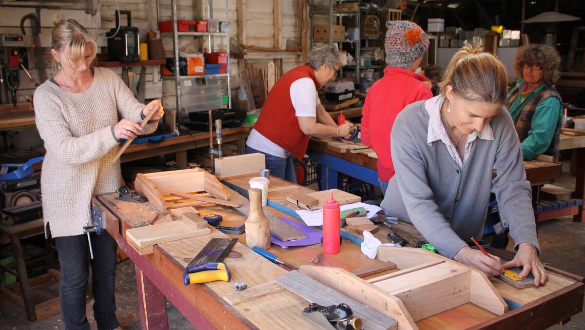 Sally Pryor and Jenny Van Stekelenburg make a shelf at the Woodworking for Women workshop. 