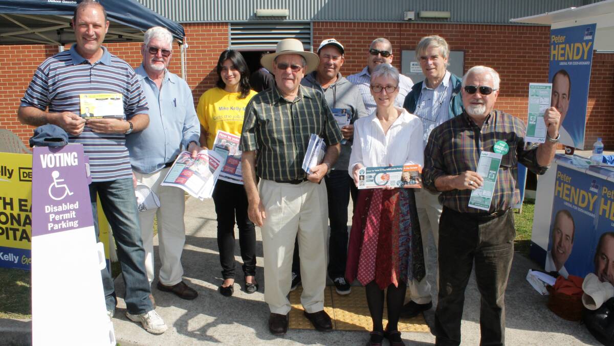 Handing out flyers for their respective parties at Bega High School for the 2013 Federal Election are (from left) Leo Hodgson, John Seckold, Amy Foster, Herb Parbery, Gavin Parbery, Keith Hughes, Vicki Younger, Graeme Bloomfield and Bob Porter.