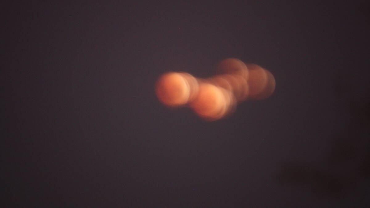 Just for a laugh - this is a shot of the lunar eclipse before I ran for my tripod. Photo Ben Smyth.