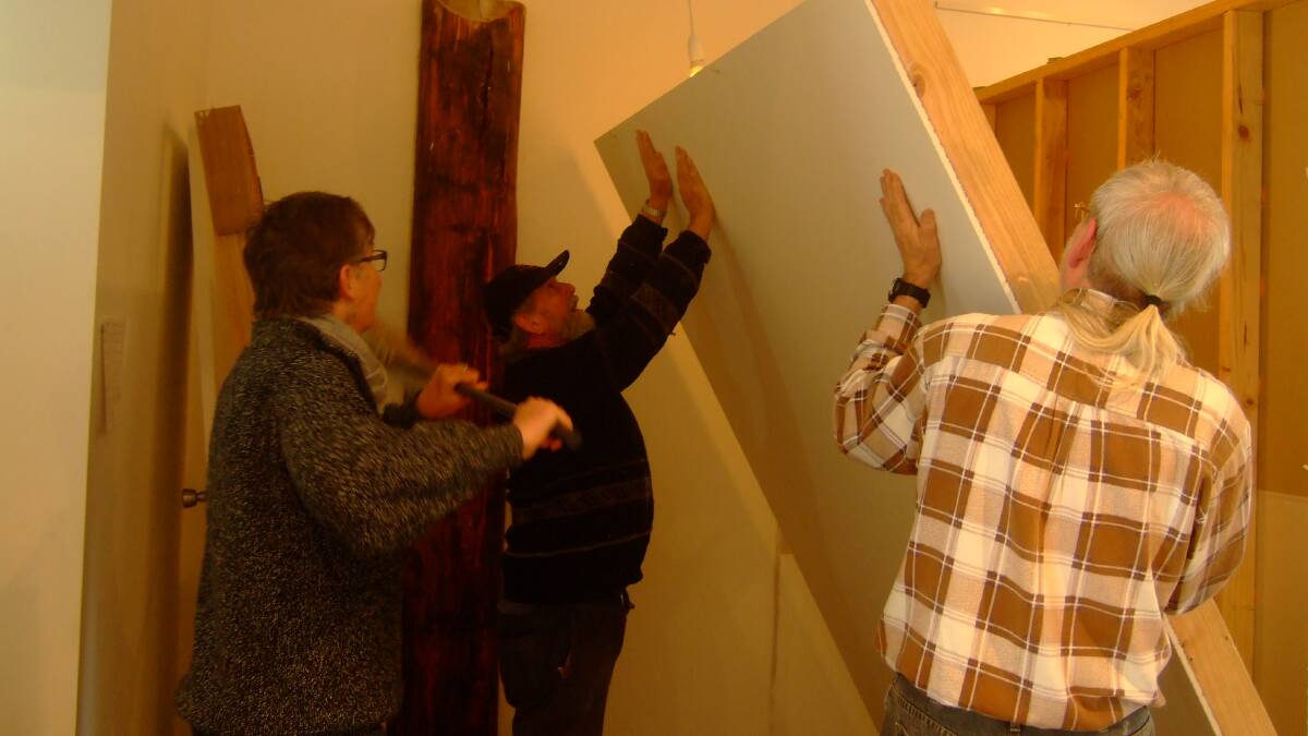 Pauline Balos, Bevan Cursley and Steve Stafford assisted with the reconstructing of walls at the Shop 7 Artspace.