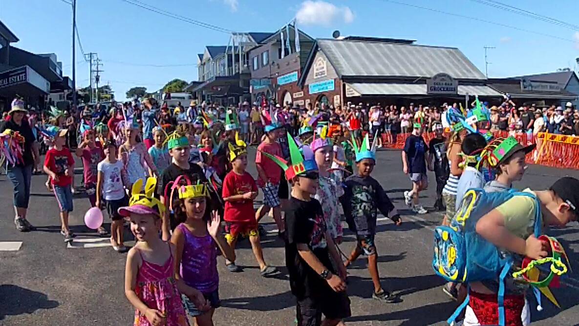 Bermagui school children take part in the Seaside Fair street parade last year. The annual event, coupled with Sculpture on the Edge, is thought to bring in close to 10,000 visitors to the seaside town. Photo: Ken Jacobs.