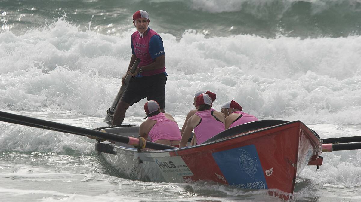 The Tathra women’s surf boat crew finally gets a smooth run through the break.