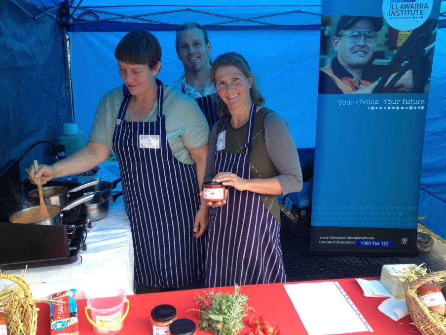 Making a Buck From Beetroot TAFE course students (from left) Heidi Brennan, Mary Jane Glasson and Chris Aitken sell their homemade sauces at the Bega SCPA market on Friday.
