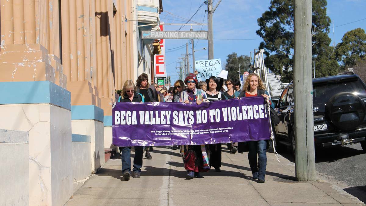 A large group show support for continued funding for the Bega Women's Refuge during a rally earlier in August.