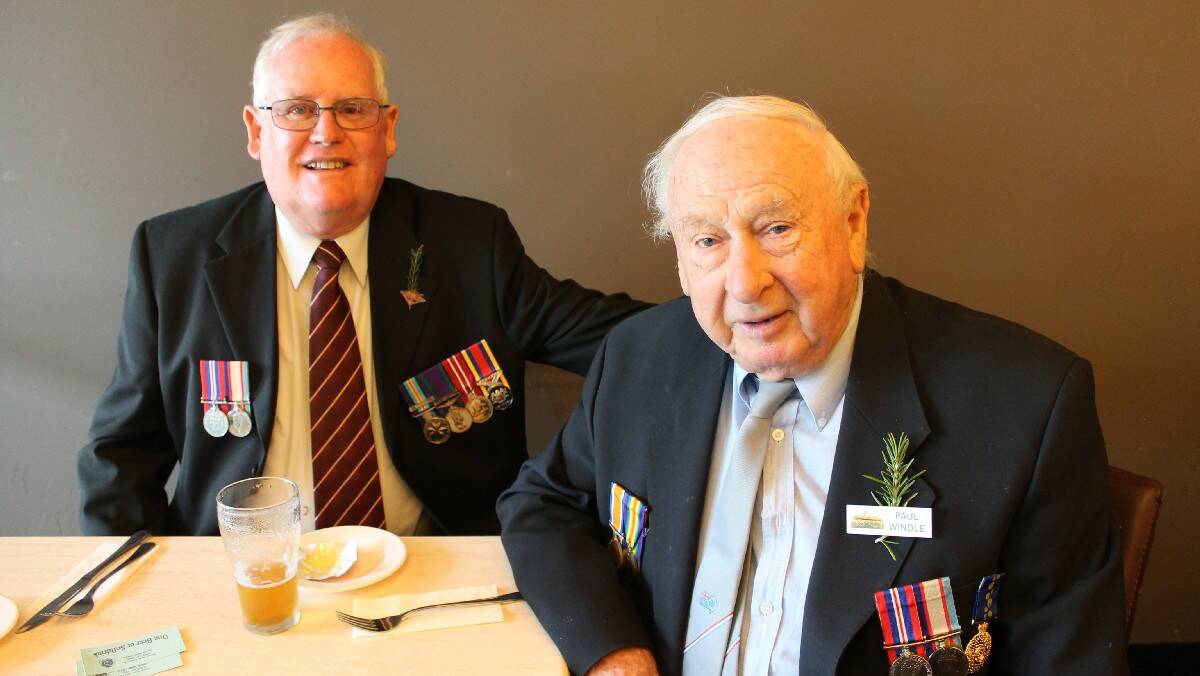 Indonesian/Malaysian confrontation veteran John Eivers (left) and eldest member of Bega RSL and ex-navy personnel Paul Wander at Club Bega after the Anzac Day morning service.