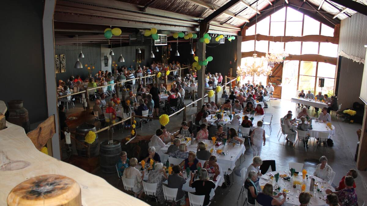 The crowd of around 160 enjoy lunch during the Can Assist auction.