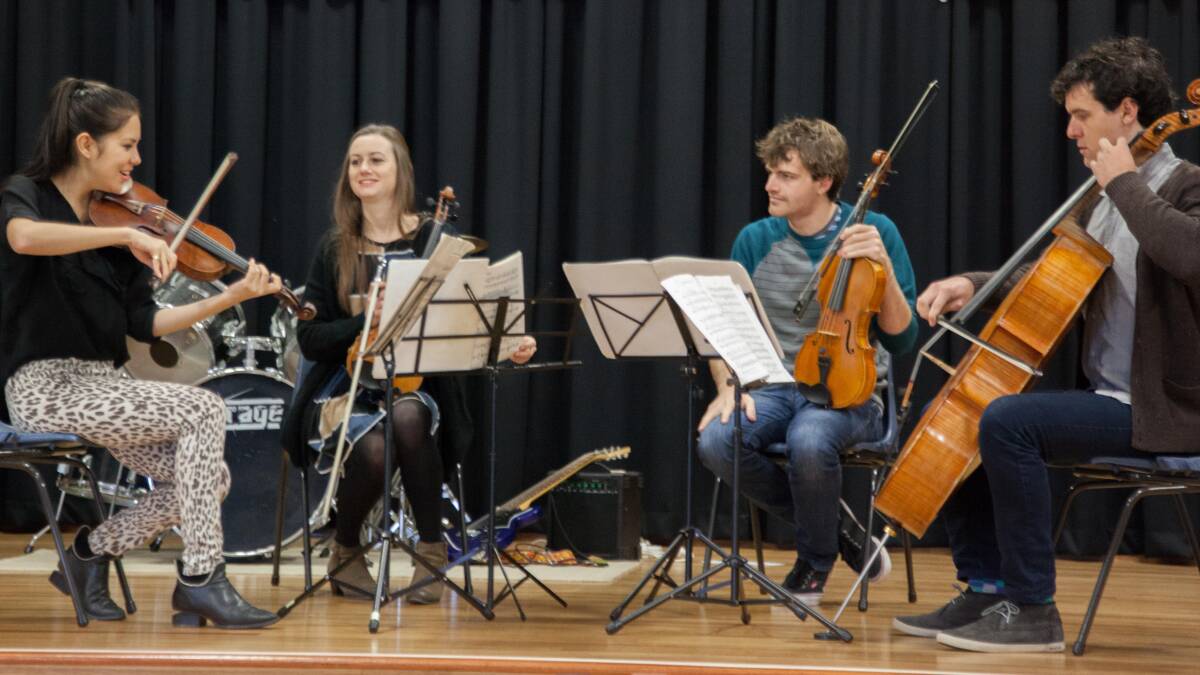 The Auric Quartet rehearse ahead of performing at this weekend’s Four Winds Festival. The group - comprising (from left) Francesca Laing (violin), Kate Sullivan (violin), Jarrad Mathie (cello) and Matthew Laing (viola) - was in residency during 2013 working with local orchestras and music students. Photo: Rob Tacheci.