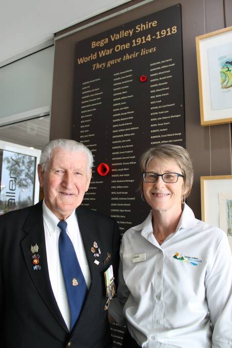 Bega library local and family history librarian Linda Albertson and RSL Bega sub-branch president Tom Blake admire the honour board.