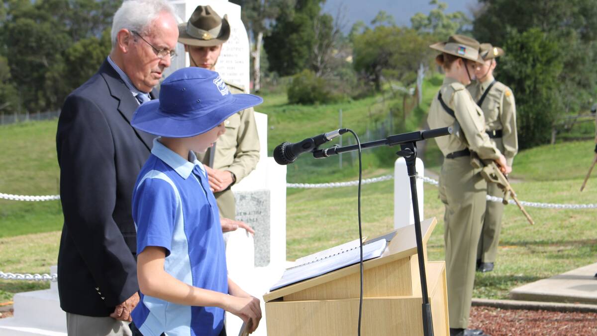 Ben Keyes from Bemboka Public School gives the Prayer for the Queen at  the Anzac Day commemorative service.