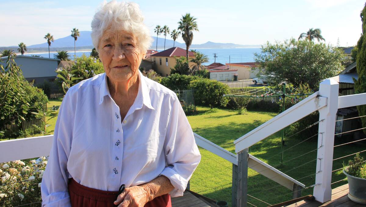 Bermagui resident Gloria Sherwin lives with her husband adjacent to where a Woolworths supermarket will be built. The development will block the view of the ocean that can be seen above her left shoulder. 