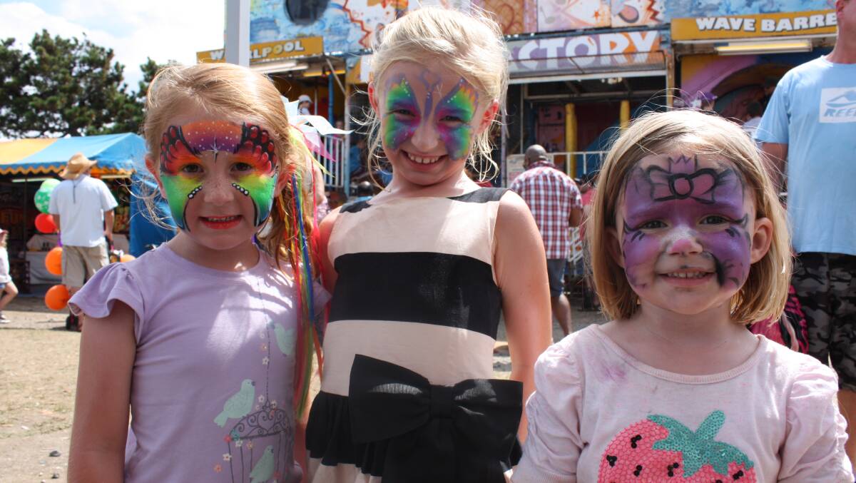 Lucia Battye, Lucy Whalan and Sophie Whalan enjoy sideshow alley at the Seaside Fair.