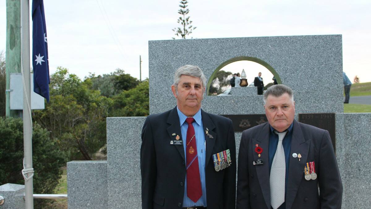Bermagui RSL treasurer Bob Shearing (left) and president Neville Staehr at the war memorial after the dawn service.  