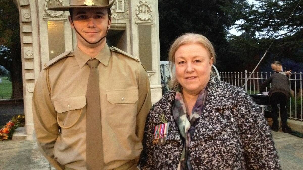 ADFA cadet Jonathon Lowe and his mother Ann Lowe at the Bega dawn service. Ms Lowe is wearing the medals of her father Keith Palfery, who served in WW2.