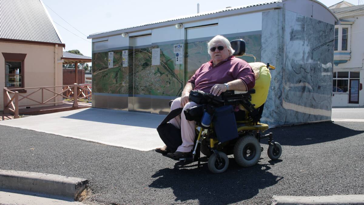 Ian Dalwood of Kalaru is unhappy with access to the public toilet facility in Bega, including the kerb cut from the car park and the entry button higher than Australian Standards.