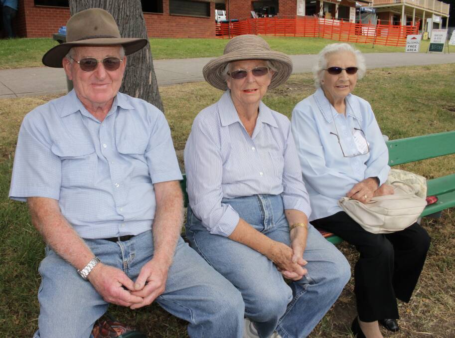 Watching the showjumping action are Bega trio (from left) Ron and Gay Atkins and Betty Britten.