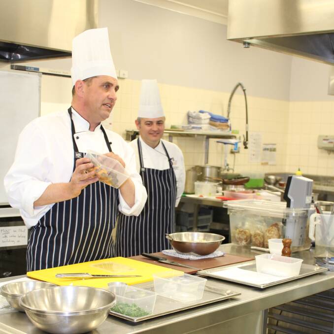 Garry Farrell and Neil Abrahams lead a masterclass for student chefs at TAFE Illawarra Bega campus