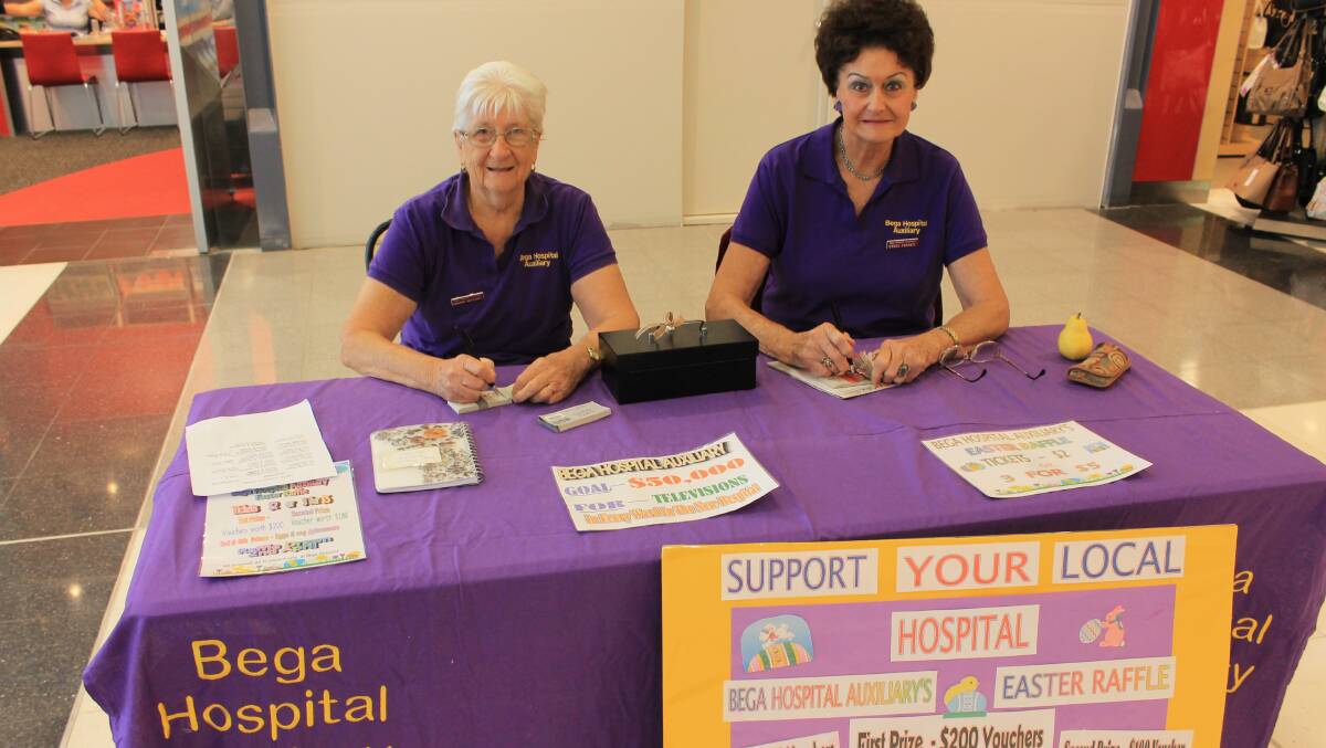 Bega Hospital Auxiliary members Dorothy Mullaney and Ethel Finney sell raffle tickets in Sapphire Marketplace.