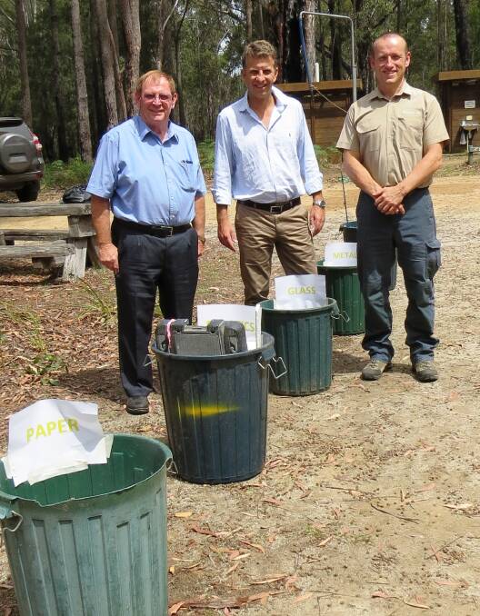Bega Valley Shire Mayor Michael Britten, Member for Bega Andrew Constance and Bournda Environmental Education Centre principal Doug Reckord discuss a container deposit scheme in the Bega Valley.