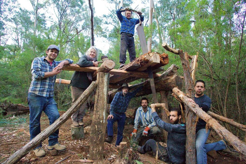 NSW craftsmen Jeff Donne (left) and Richard Jermyn (top) with students and a full size pitsaw at the Working with Nature workshop in Bemboka  
