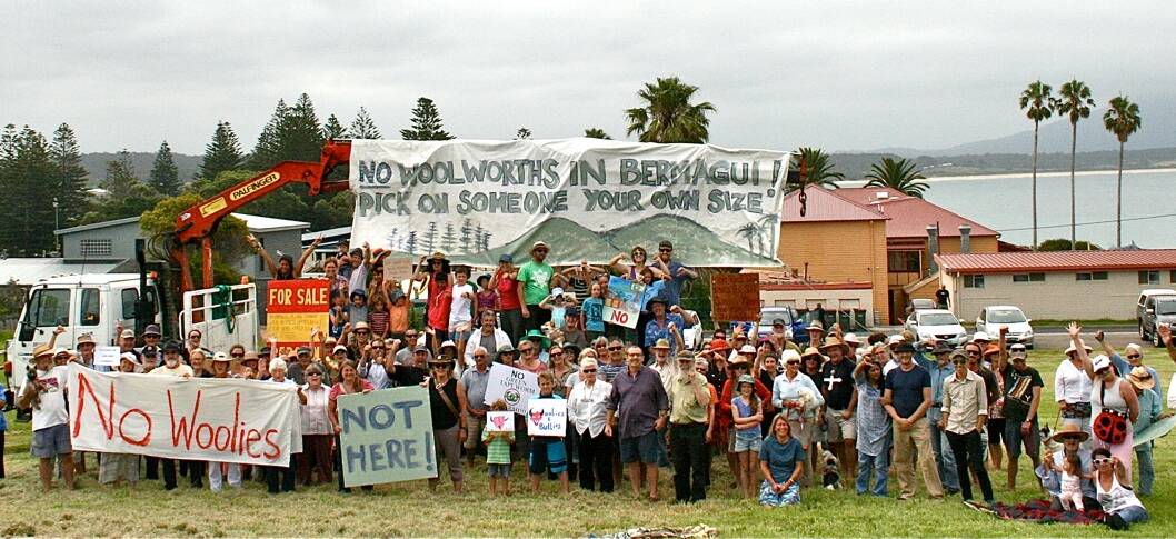 A group of anti-Woolworths campaigners gather on the Bermagui site earlier this year.