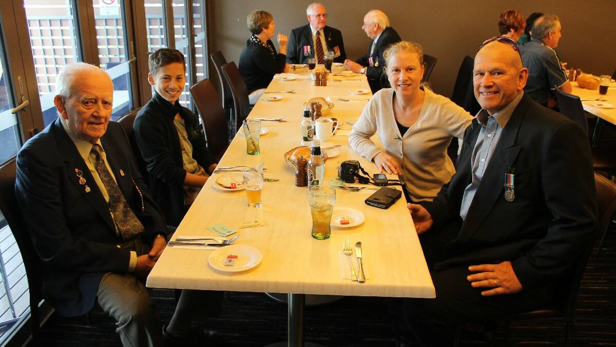 David Lawrie, Cailem Campbell, Donna Campbell and Steven Lawrie at have lunch together at Club Bega after the Anzac Day morning service.