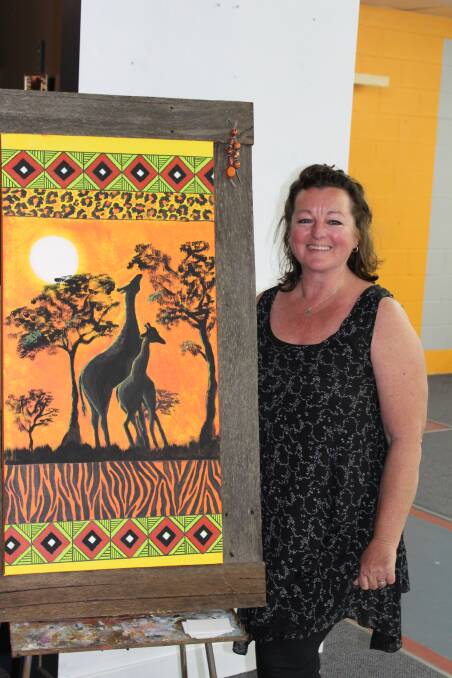 Debbie Hutchinson with one of her works  at her Crafters’ Market in the former Retravision building in Gipps Street, Bega.