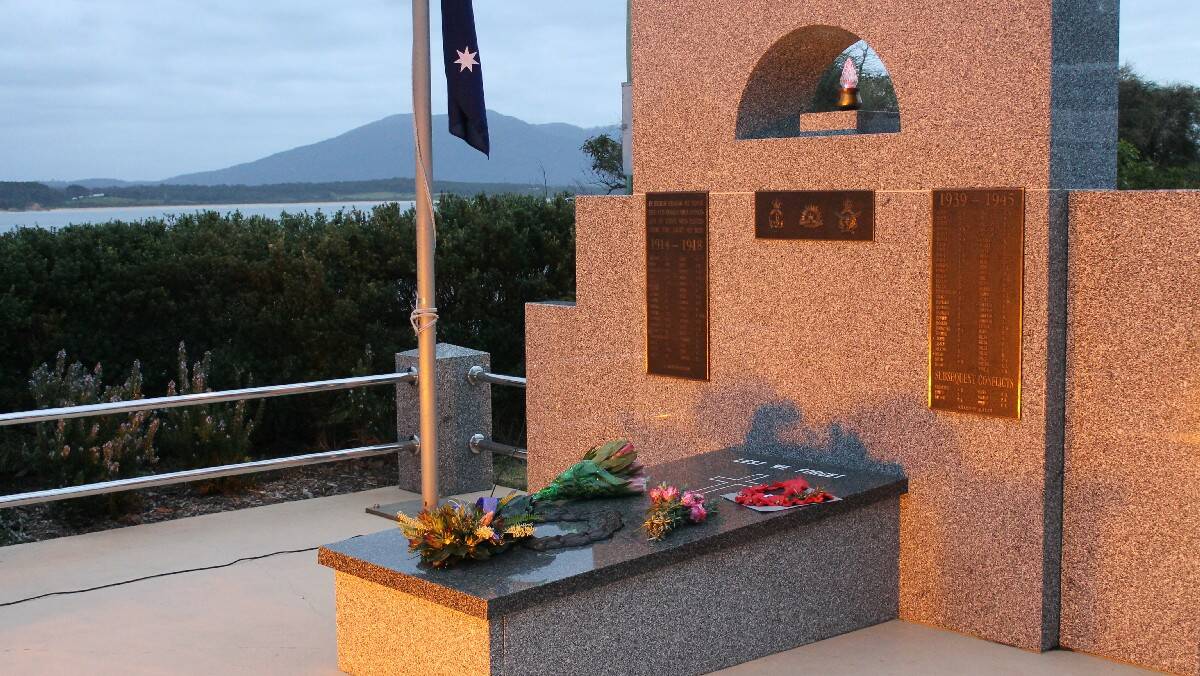 The wreaths laid on the serene war memorial at Bermagui. 