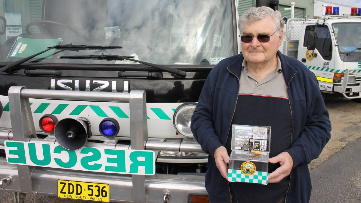 Bega Volunteer Rescue Association patron Bevan Goldberg outside the VRA shed with one of the money boxes where people can donate to the squad. 