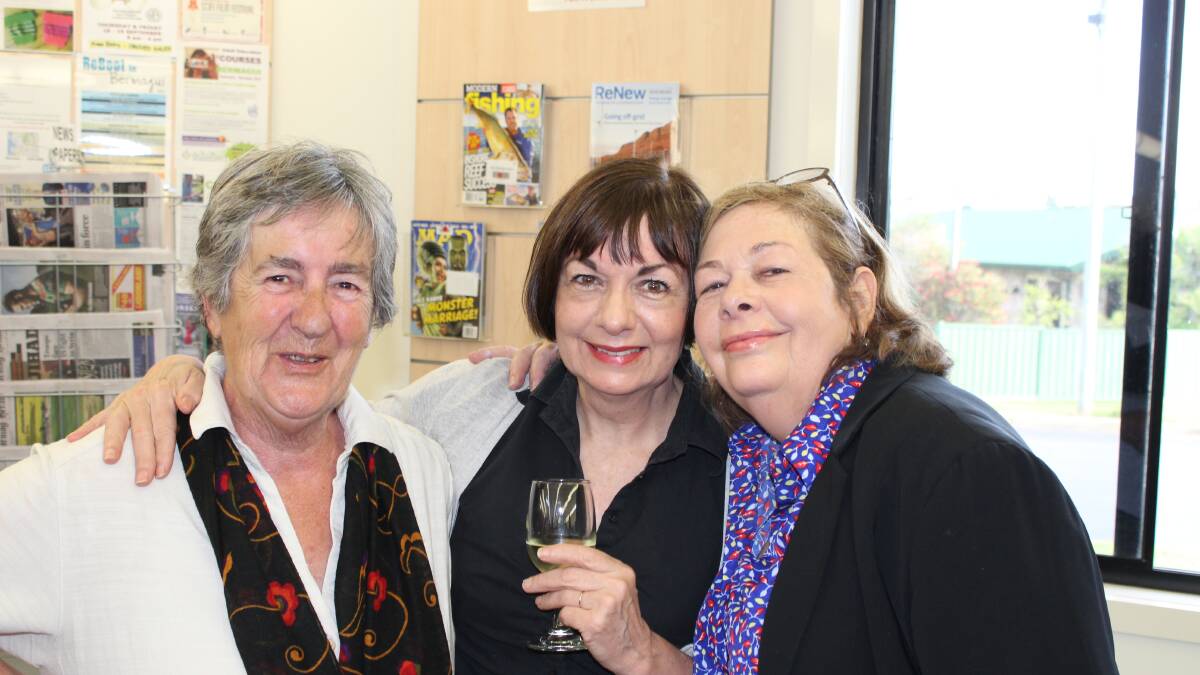 Festival committee member Heather O'Connor (left) with Deb and Sue Masters at the Bermagui Library.