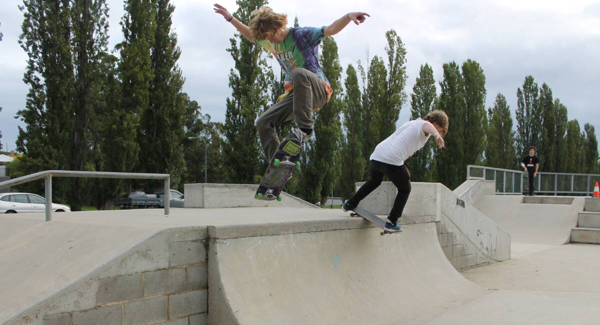 Ayden Limb (left) and Zane Marsden demonstrate their skating skills, which they will put to the test at the Youth Week Skate Competition in Bega on Sunday. 