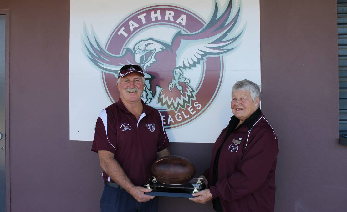 Tathra club president Chris Sly holds the Bemboka to the Beach football with Maureen Waterson. 